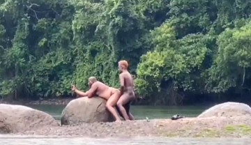 Fucking in the river in the rain with a hot bear and another hottie