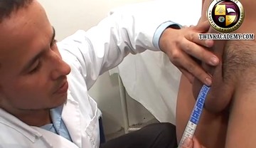 The campus doctor measures the Latino boy's uncut cock